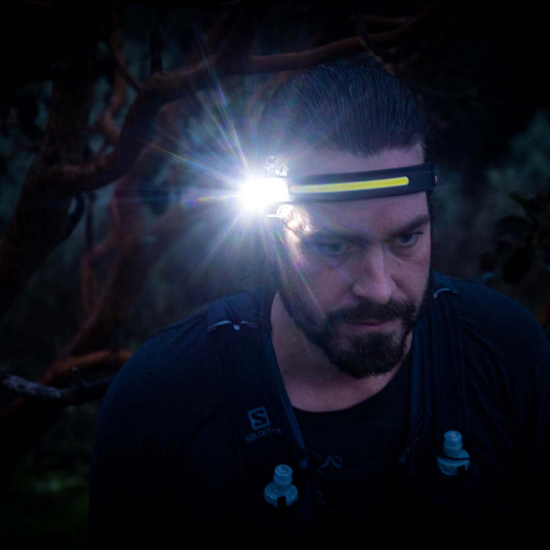 Trail Runner wearing wide angle headlamp/ head torch while running